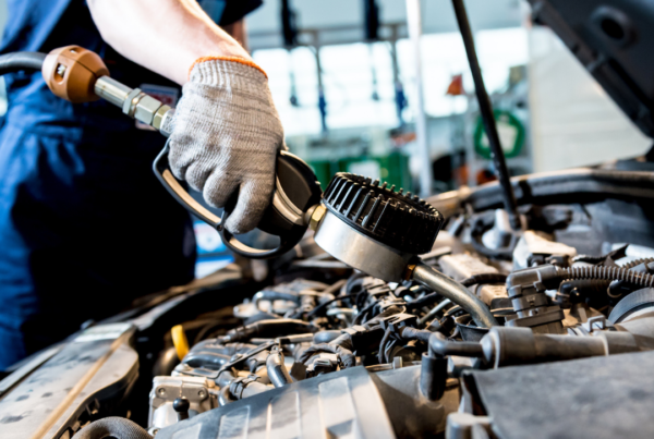 Oil change in Irwindale – technician performing synthetic oil service on car engine