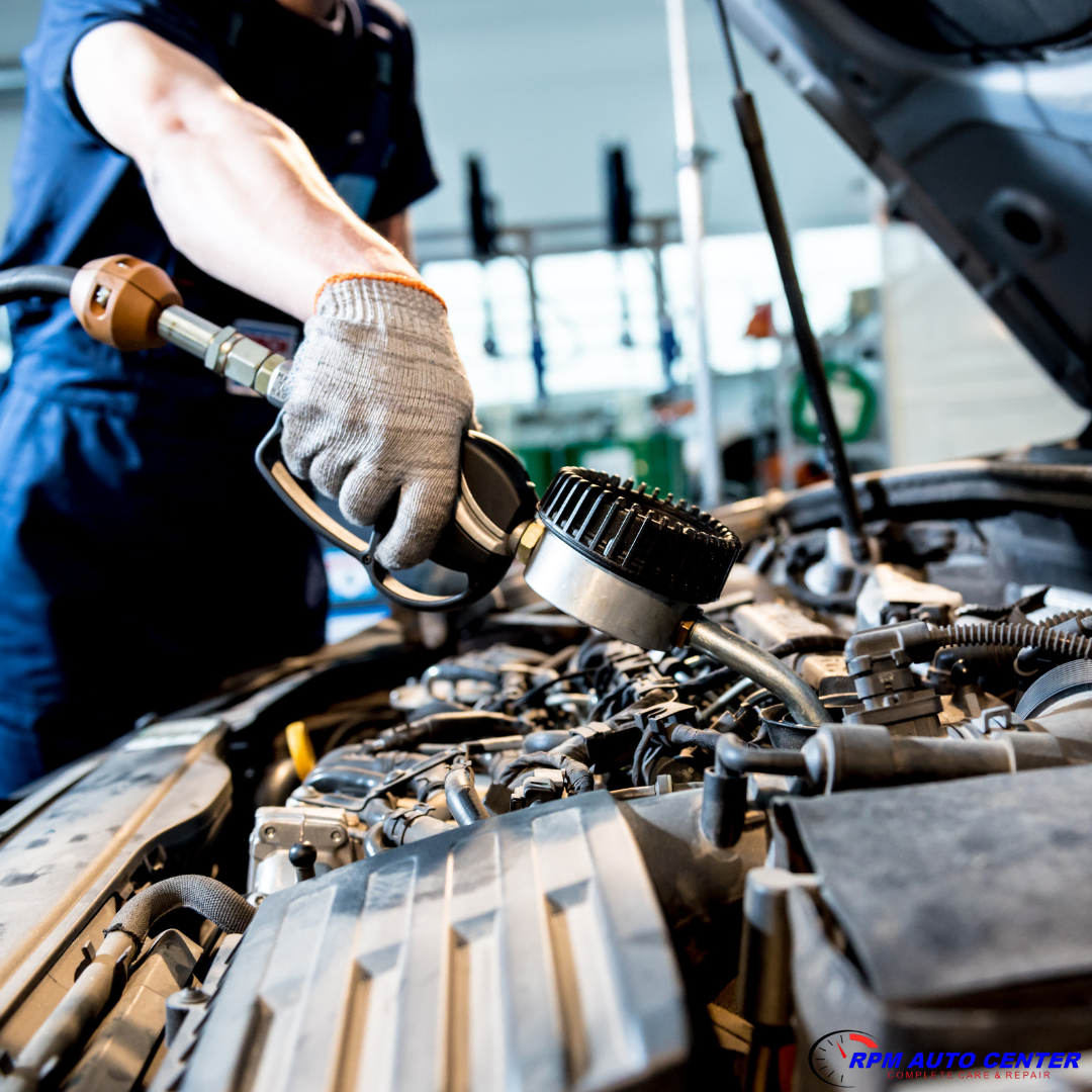 Oil change in Irwindale – technician performing synthetic oil service on car engine