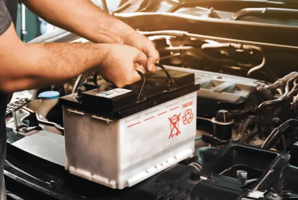 Winter car maintenance in Irwindale - mechanic inspecting vehicle battery