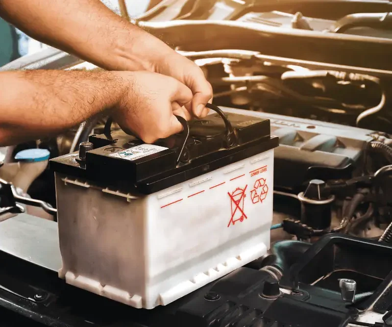 Winter car maintenance in Irwindale - mechanic inspecting vehicle battery