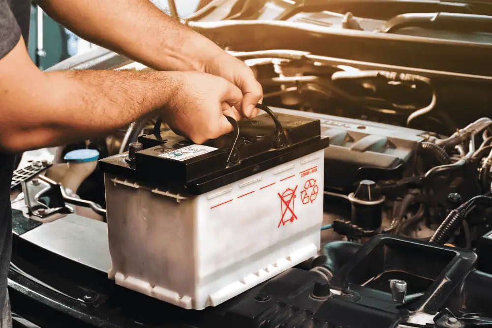 Winter car maintenance in Irwindale - mechanic inspecting vehicle battery